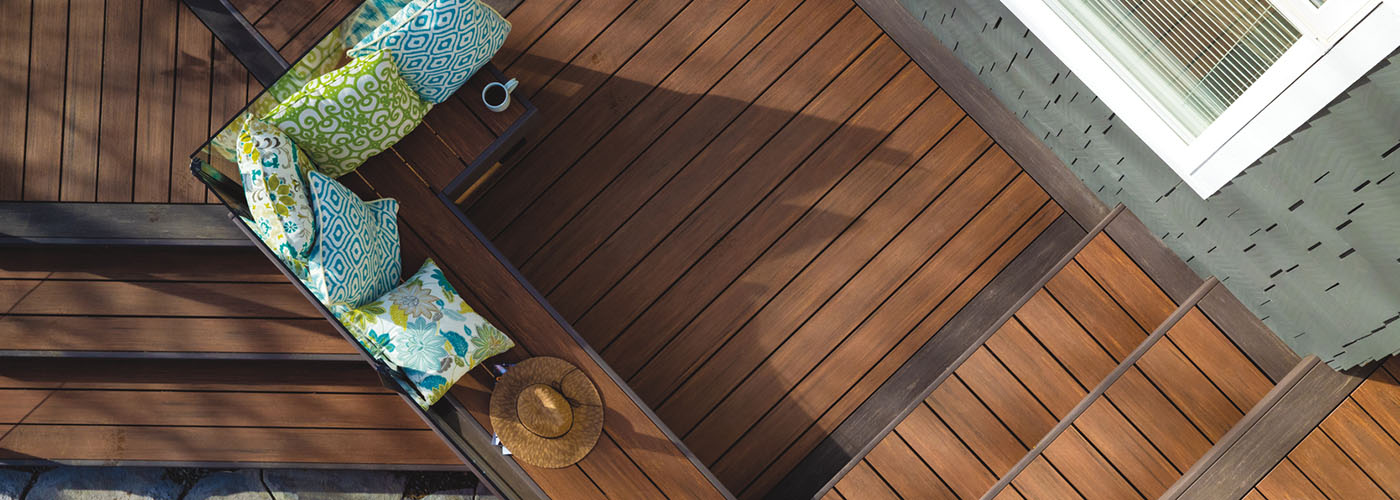 Direct overhead view of a composite deck with two-toned stairs and built-in bench